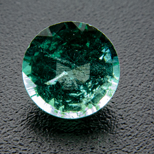 Emerald from Zambia. 0.56 Carat. Round, very distinct inclusions