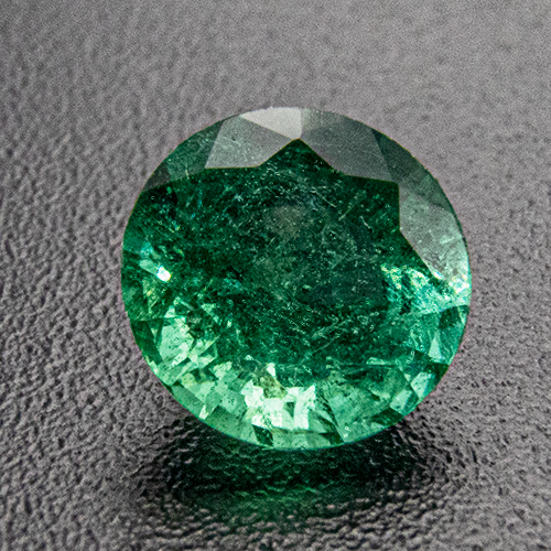 Emerald from Zambia. 0.48 Carat. Round, very distinct inclusions