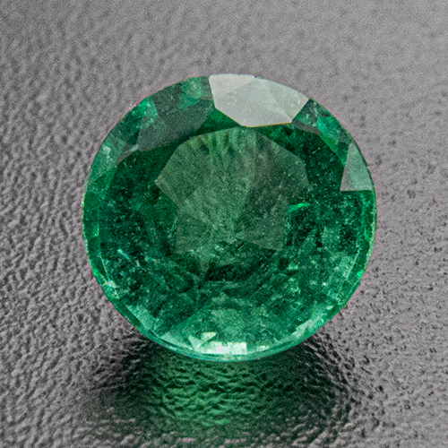 Emerald from Zambia. 0.5 Carat. Round, distinct inclusions