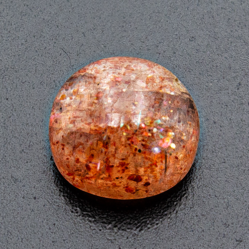 Sunstone (Aventurine Feldspar) from India. 3.87 Carat. Cabochon Round, very distinct inclusions