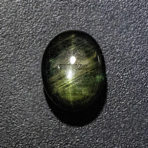 Black Star Sapphire from Thailand. 1.71 Carat. Cabochon Oval, semi-translucent