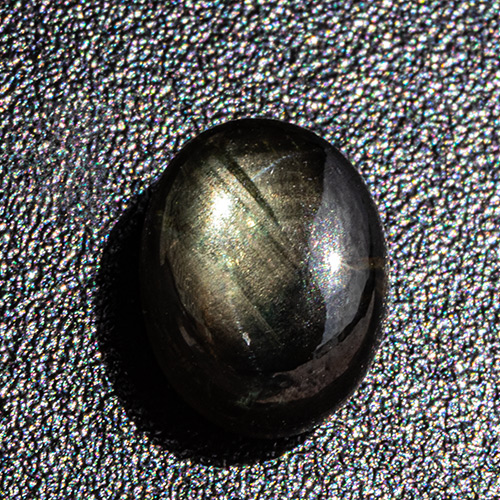 Black Star Sapphire from Thailand. 2.17 Carat. Weak star is only visible in very strong spotlight or direct sunlight and refuses to be photographed...