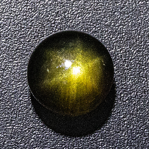 Black Star Sapphire from Thailand. 2.27 Carat. Cabochon Round, semi-translucent