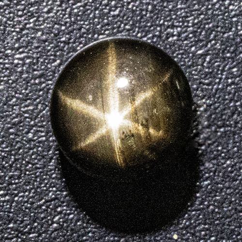 Black Star Sapphire from Thailand. 1 Piece. Cabochon Round, semi-translucent