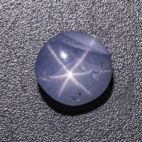 Star Sapphire from Sri Lanka. 2.14 Carat. Three small cavities but good colour and excellent star, can be set to look round