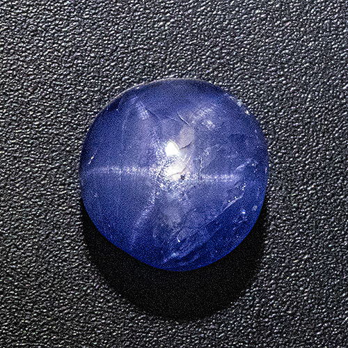 Star Sapphire from Sri Lanka. 3.38 Carat. Very good star and intense colour, some small natural cavities