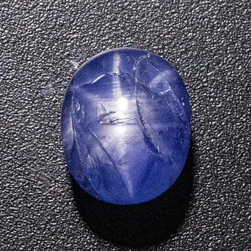 Star Sapphire from Sri Lanka. 4.09 Carat. Very good star and colour, several natural cracks