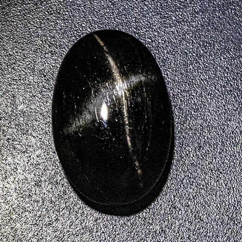 Star Diopside from India. 13.46 Carat. Cabochon Oval, opaque