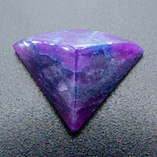Sugilite from South Africa. 6.66 Carat. Cabochon Fan, opaque