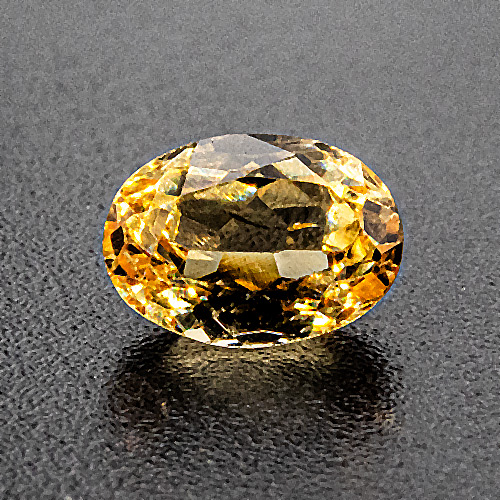 Golden topaz from Brazil. 0.65 Carat. Oval, small inclusions