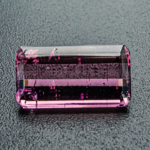Tourmaline (Rubelite) from Brazil. 1.57 Carat. Shows natural crack across one corner (upper left on photo), set with care!