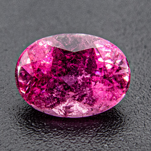 Tourmaline (Rubellite) from Brazil. 0.82 Carat. Oval, very distinct inclusions