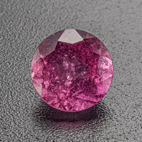 Tourmaline (Rubellite) from Brazil. 0.7 Carat. Round, very, very distinct inclusions
