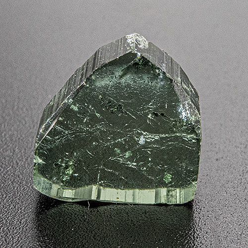 Water melon tourmaline from Brazil. 0.86 Gramm. Shows several small natural cavities on both sides