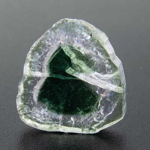 Tourmaline from Pakistan. 0.65 Gramm. Disc, very, very distinct inclusions